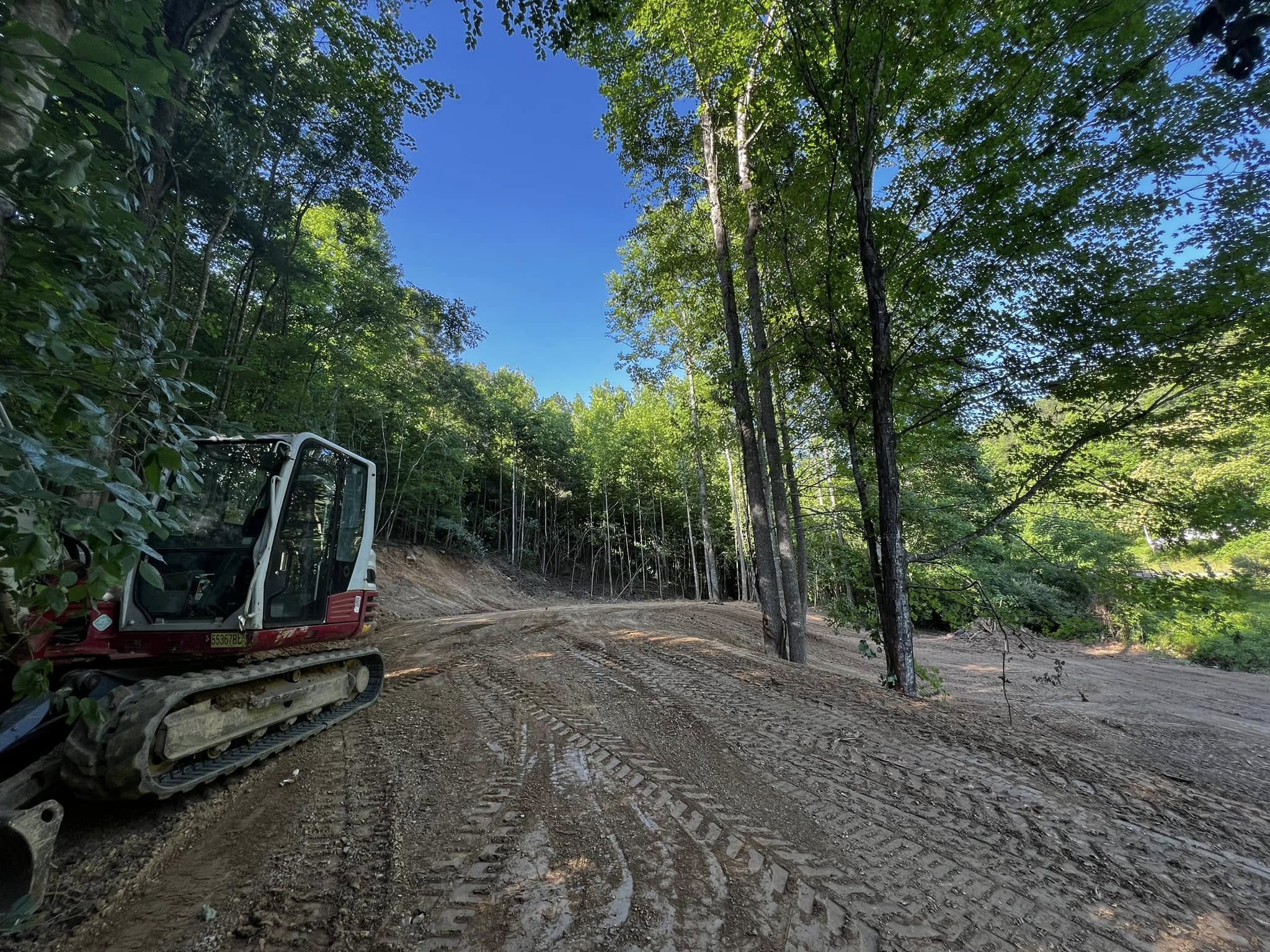 Excavator working on demolition and site clearing project
